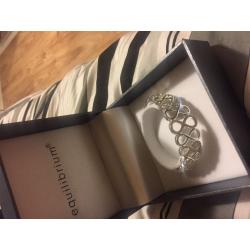 Equilibrium love knot bracelet