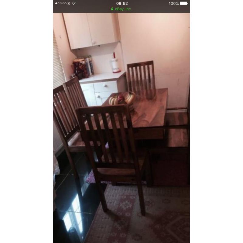 table and six chairs Is very good condition
