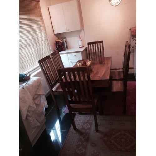 table and six chairs Is very good condition