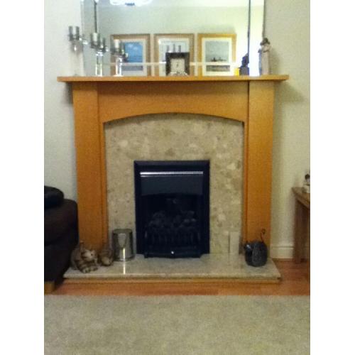 Beech coloured fire surround with marble back and hearth.