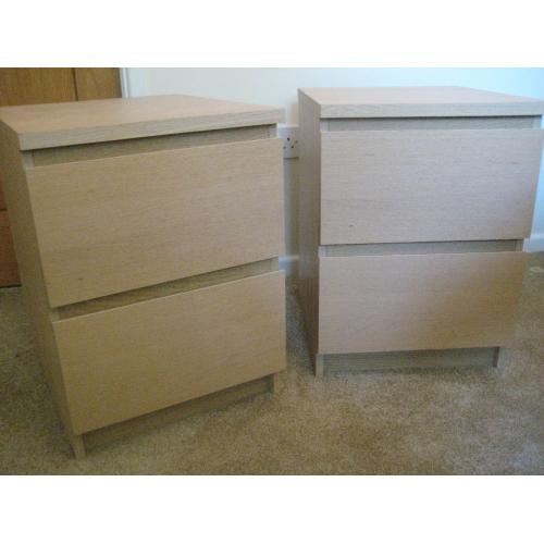 Two light wood bedside 2 drawer cabinets