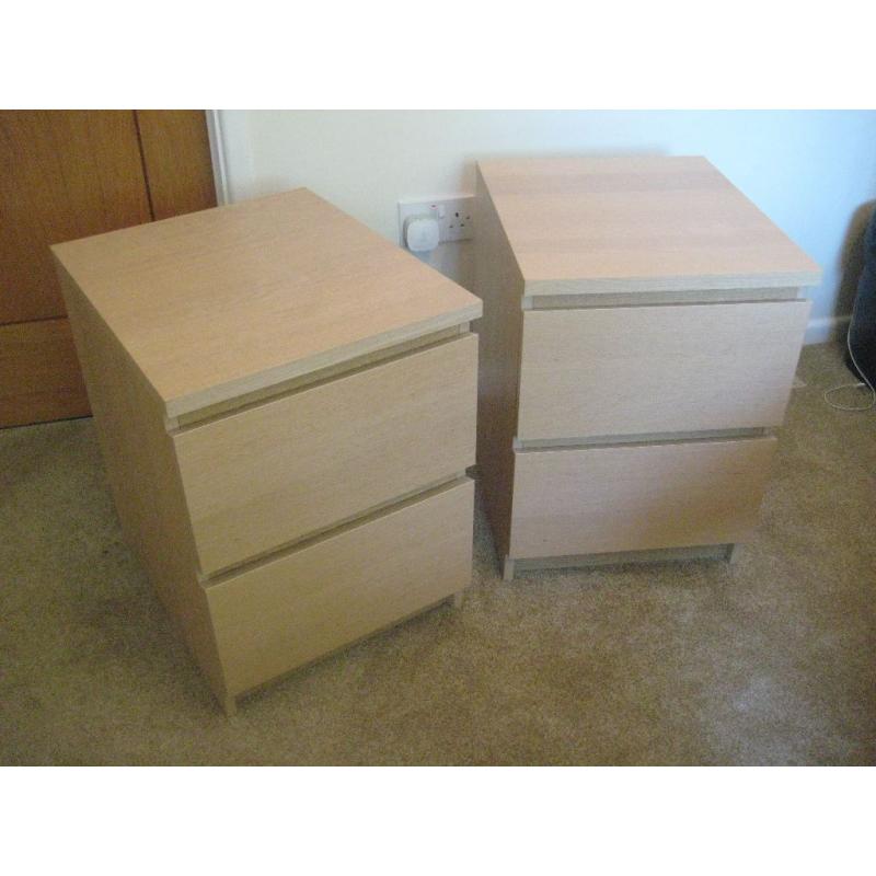 Two light wood bedside 2 drawer cabinets