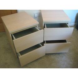 Two light wood bedside 2 drawer cabinets