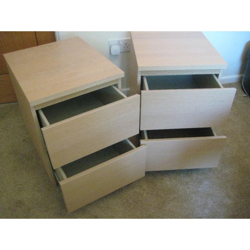 Two light wood bedside 2 drawer cabinets