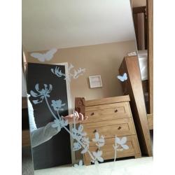 Mirror with butterfly detail