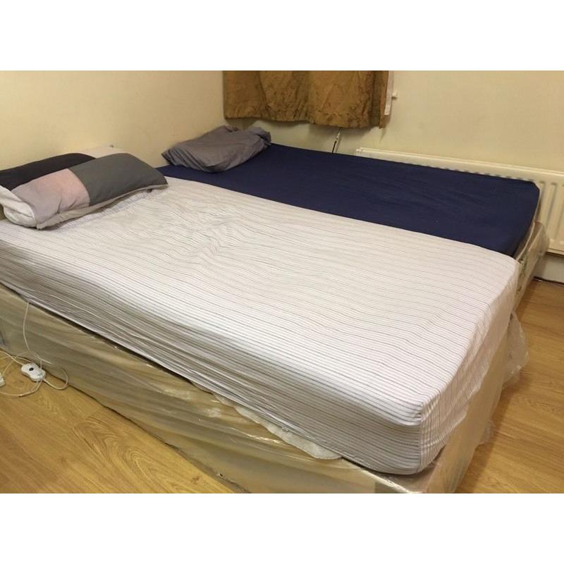 Brand-new single divan bed plus used mattress