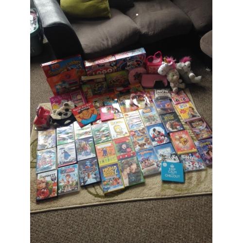 Group of DVDs games cuddly toys and few other things