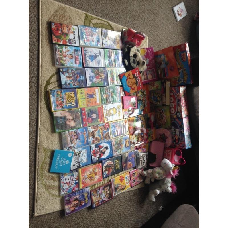 Group of DVDs games cuddly toys and few other things