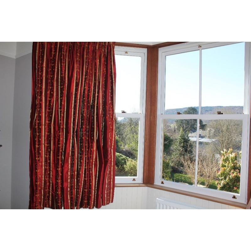 Beautiful red and gold curtains for a big window