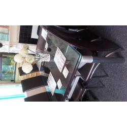 glass extendable dining table and six chairs