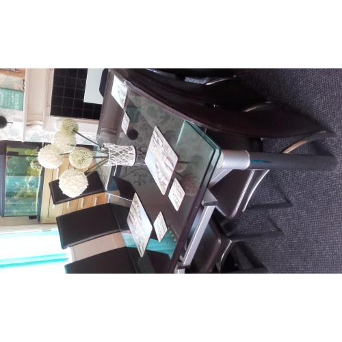 glass extendable dining table and six chairs