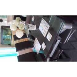 glass extendable dining table and six chairs