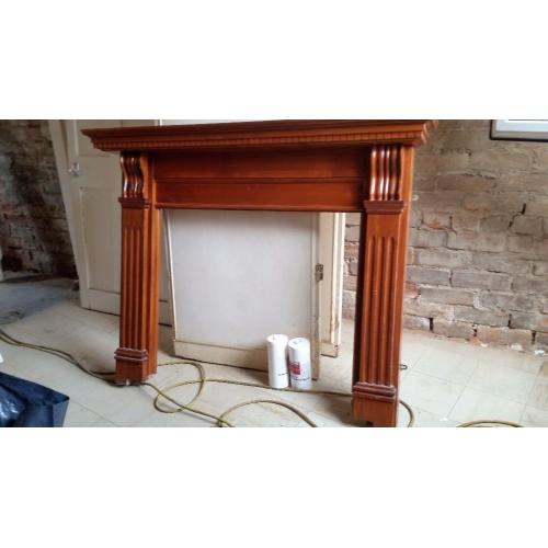 Wooden fire surround.