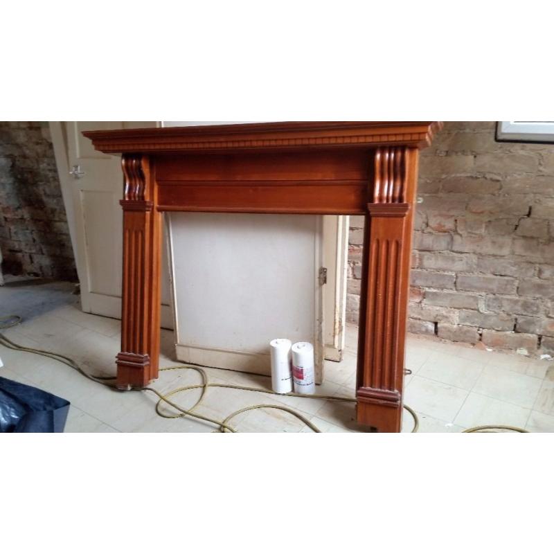 Wooden fire surround.