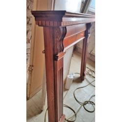 Wooden fire surround.