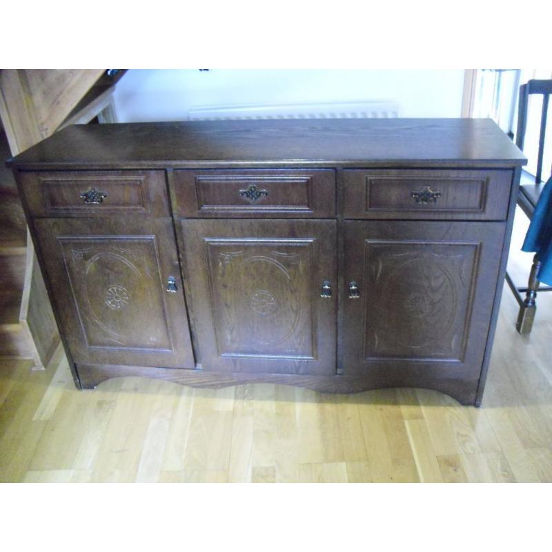 Dark wood sideboard, 3drawer, 3cupboards. Good condition. Buyer collects