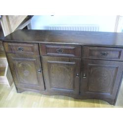 Dark wood sideboard, 3drawer, 3cupboards. Good condition. Buyer collects