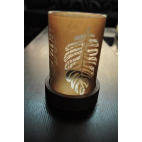 Small brown candle holder with clear leaf print on glass for sale!