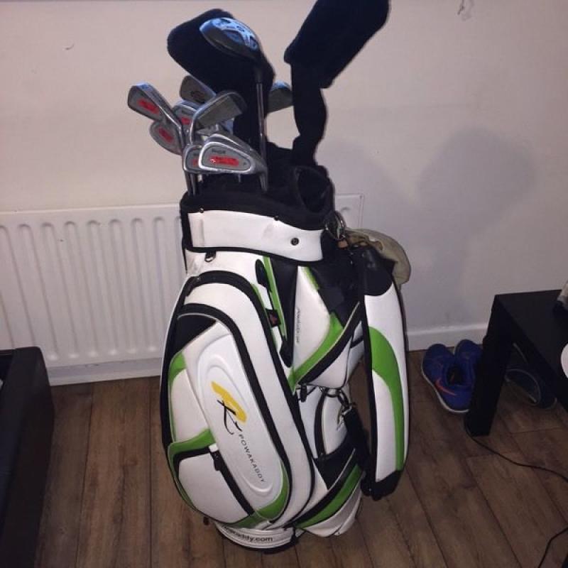 Full set of golf clubs and bag.