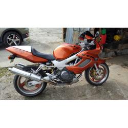honda VTR 1000 in candy orange part x 1200 harly with EFI engine or why
