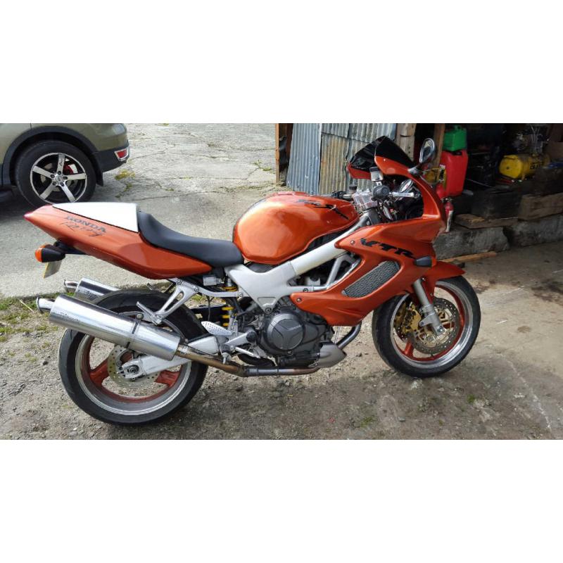 honda VTR 1000 in candy orange part x 1200 harly with EFI engine or why