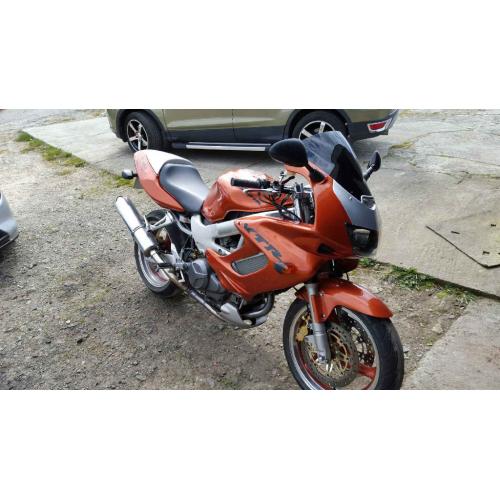 honda VTR 1000 in candy orange part x 1200 harly with EFI engine or why