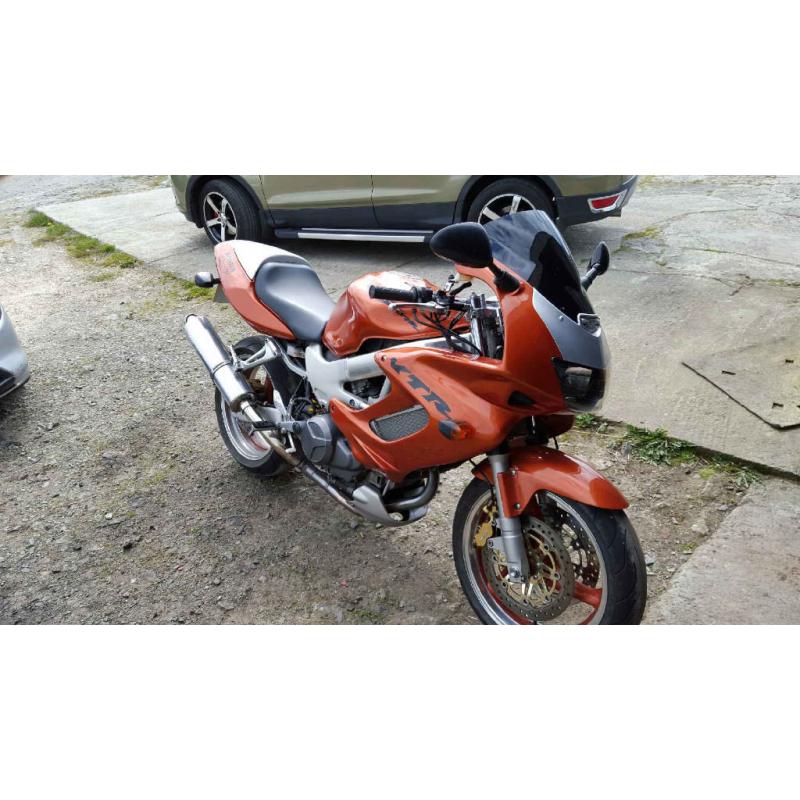 honda VTR 1000 in candy orange part x 1200 harly with EFI engine or why