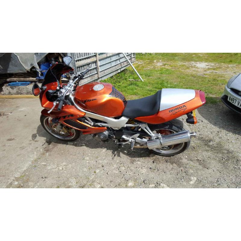 honda VTR 1000 in candy orange part x 1200 harly with EFI engine or why