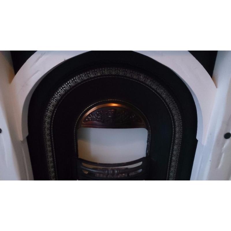 LARGE SOLID WOOD FIRE SURROUND AND CAST IRON INSET