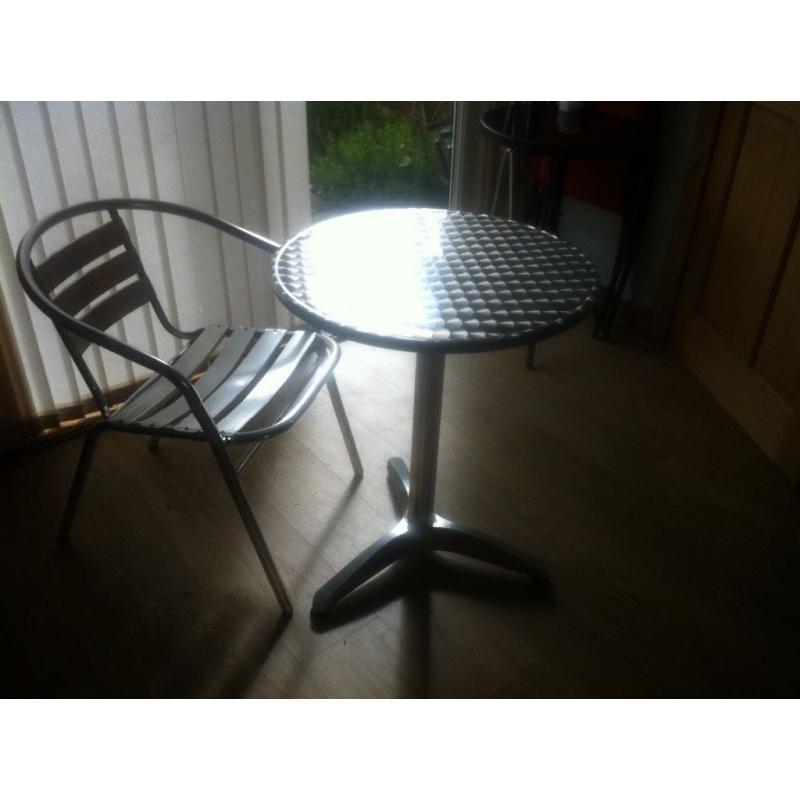 Aluminium bistro table &4 stacking chairs. Can be used indoor or outdoors. Lightweight as aluminium.