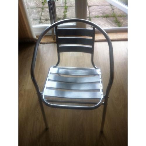 Aluminium bistro table &4 stacking chairs. Can be used indoor or outdoors. Lightweight as aluminium.