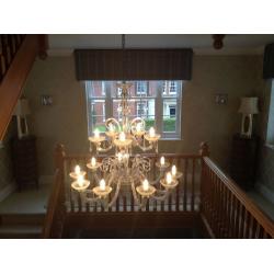 Chandeliers ... One large glass and one large brass chandelier