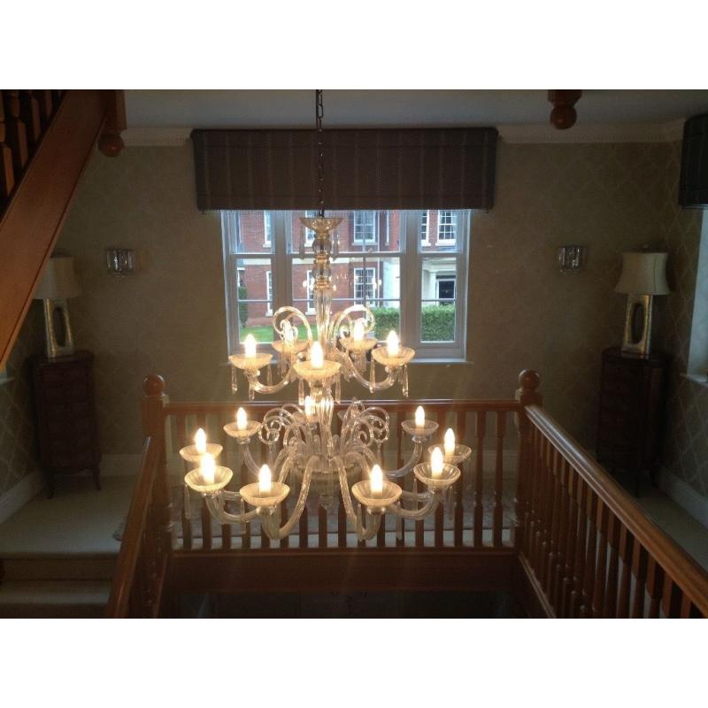 Chandeliers ... One large glass and one large brass chandelier