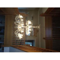 Chandeliers ... One large glass and one large brass chandelier