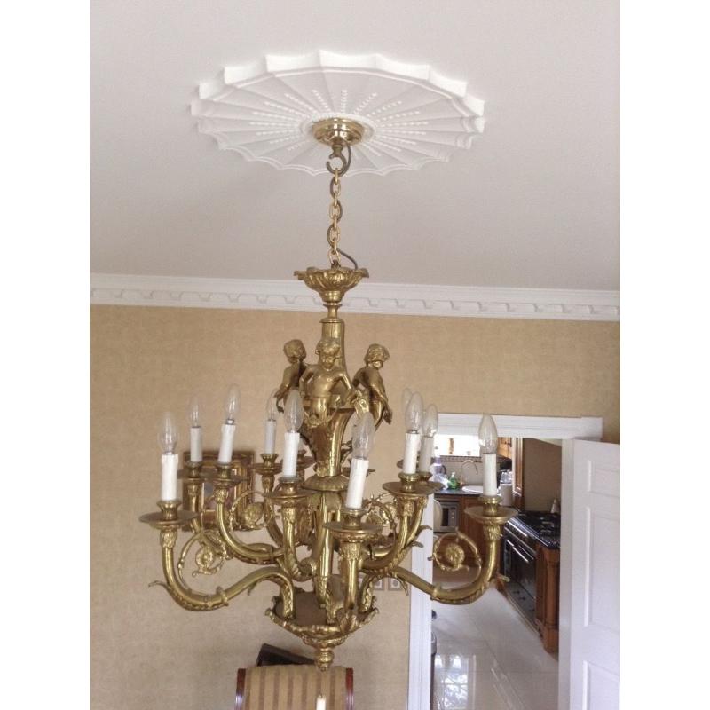 Chandeliers ... One large glass and one large brass chandelier