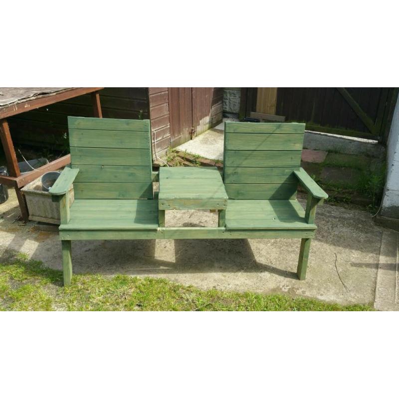 Garden bench with table in middle