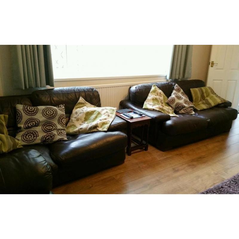 Two, large dark brown leather 2 seater sofa's
