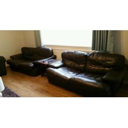 Two, large dark brown leather 2 seater sofa's