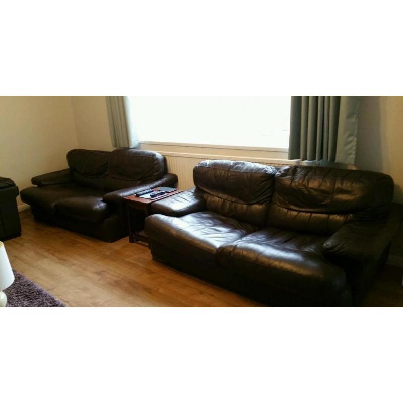 Two, large dark brown leather 2 seater sofa's