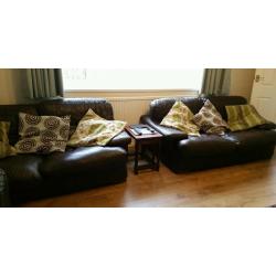 Two, large dark brown leather 2 seater sofa's