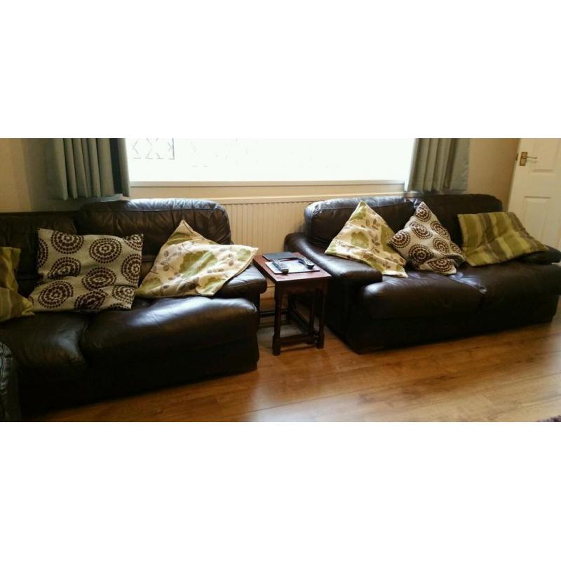 Two, large dark brown leather 2 seater sofa's