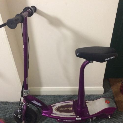 Electric razor scooter. Seat can be removed to stand up.