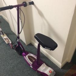 Electric razor scooter. Seat can be removed to stand up.