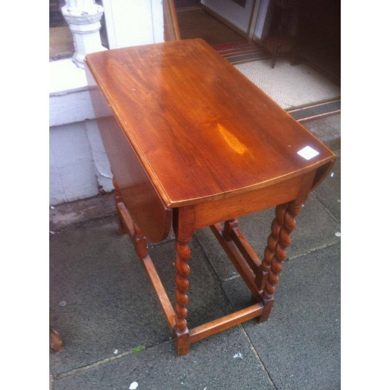 Drop Leaf table with barley twist legs , nice oval shape when up.