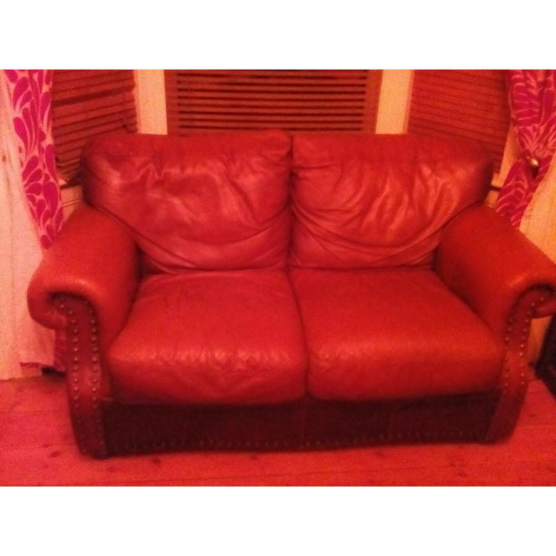 Free Brown leather studded sofa