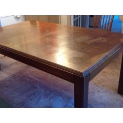 Large extendable sold heavy dark brown wood dining room table, very good condition!