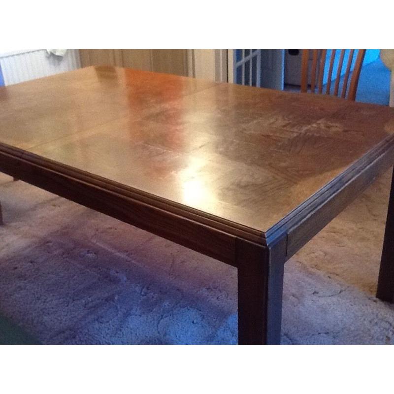Large extendable sold heavy dark brown wood dining room table, very good condition!