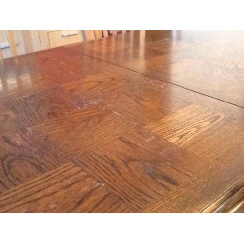 Large extendable sold heavy dark brown wood dining room table, very good condition!