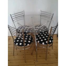 Glass dinning table and 4 chairs
