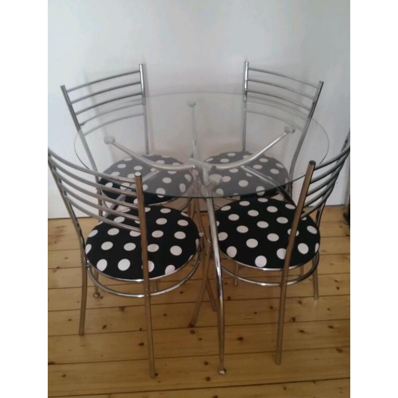 Glass dinning table and 4 chairs